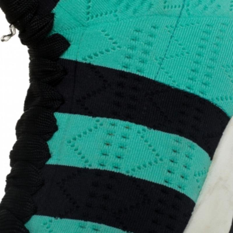 Designed in a sock-like silhouette, these sneakers from Fendi are crafted from knit fabric and feature an easy slip-on style. Play casual and cool wearing this pair that comes with black and green stripes and comfortable leather-lined insoles. These