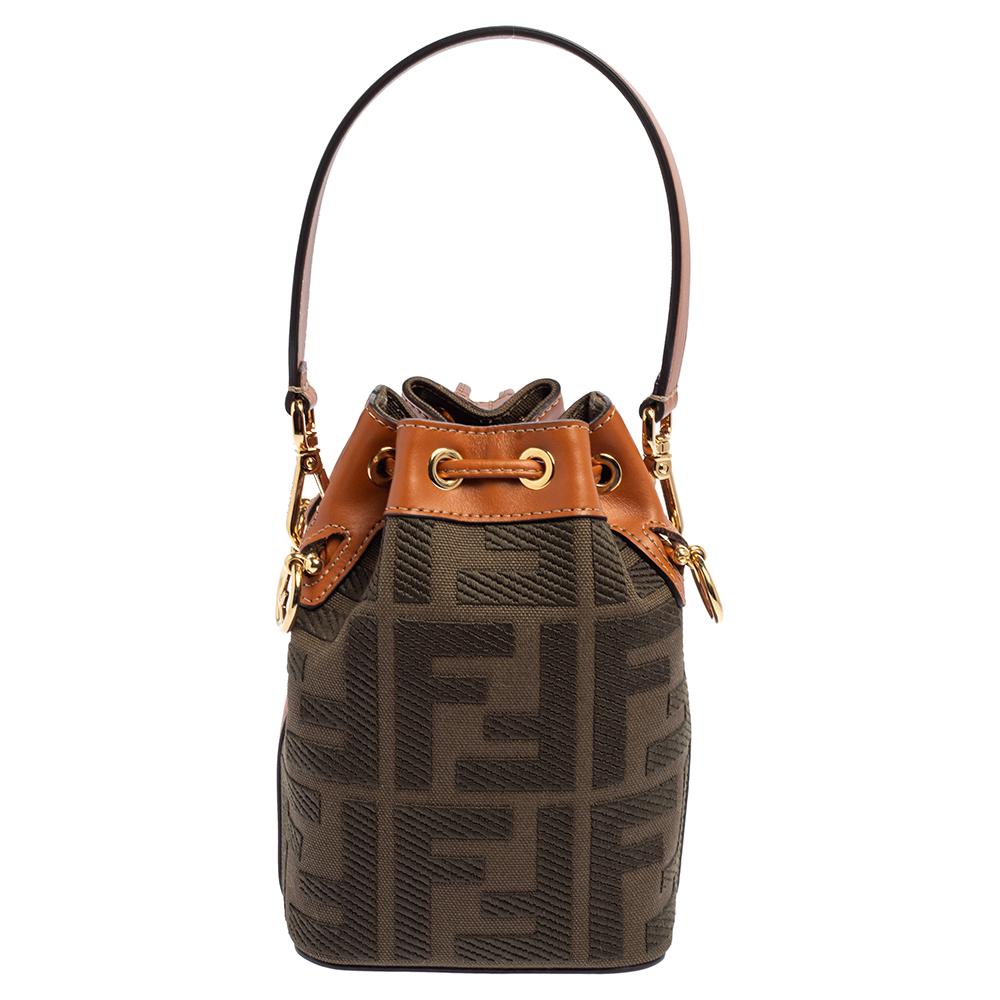 This wonderful Fendi design is made from signature Zucca canvas & leather and enhanced with gold-tone hardware. The bag has a bucket shape with a drawstring closure that secures the canvas interior. It is complete with a single handle and a shoulder