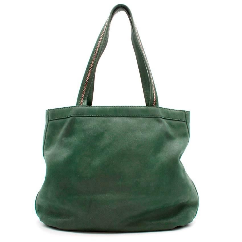 Fendi green leather and suede tote bag

Featuring:
-zipped compartment, one small pocket
-chain detail to the handles
-gold tone hardware
-sequin effect
-front centre logo plaque

Condition: 9/10 Very minor scratches to the hardware and