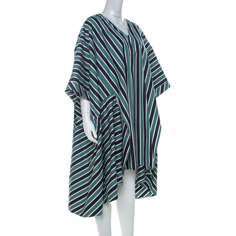 This Fendi dress is every bit classy and trendy. Elegant and comfortable, this attire is sure to be a favourite. Cut from cotton, this dress features stripes in green, white and navy blue, and a kimono-inspired structure.

Includes:  Info Booklet