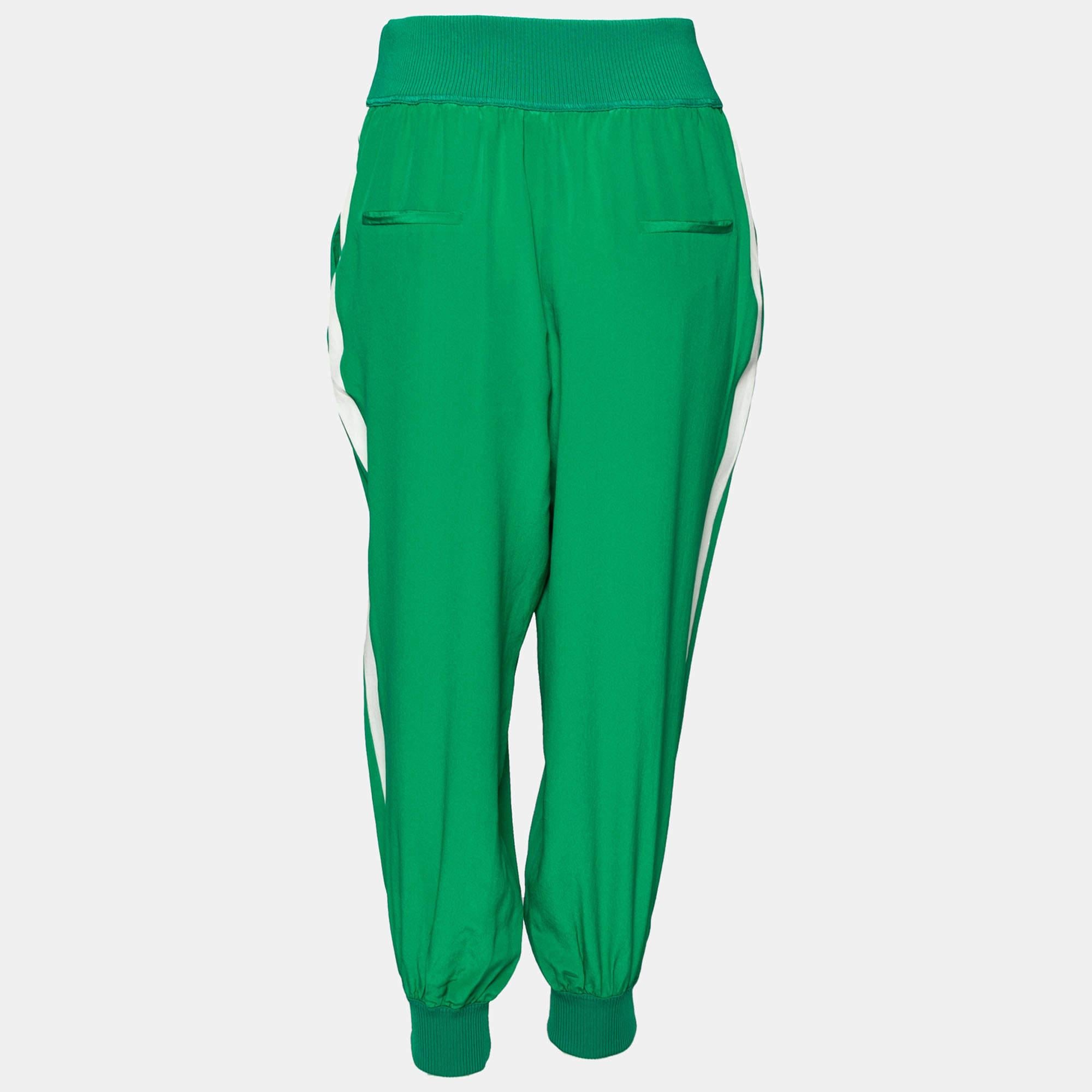 We have our eyes set on this pair of green pants from Fendi. It comes tailored from comfortable silk and has rib knit trims at the bottom and the waist. You can team it with a basic tank top and flats