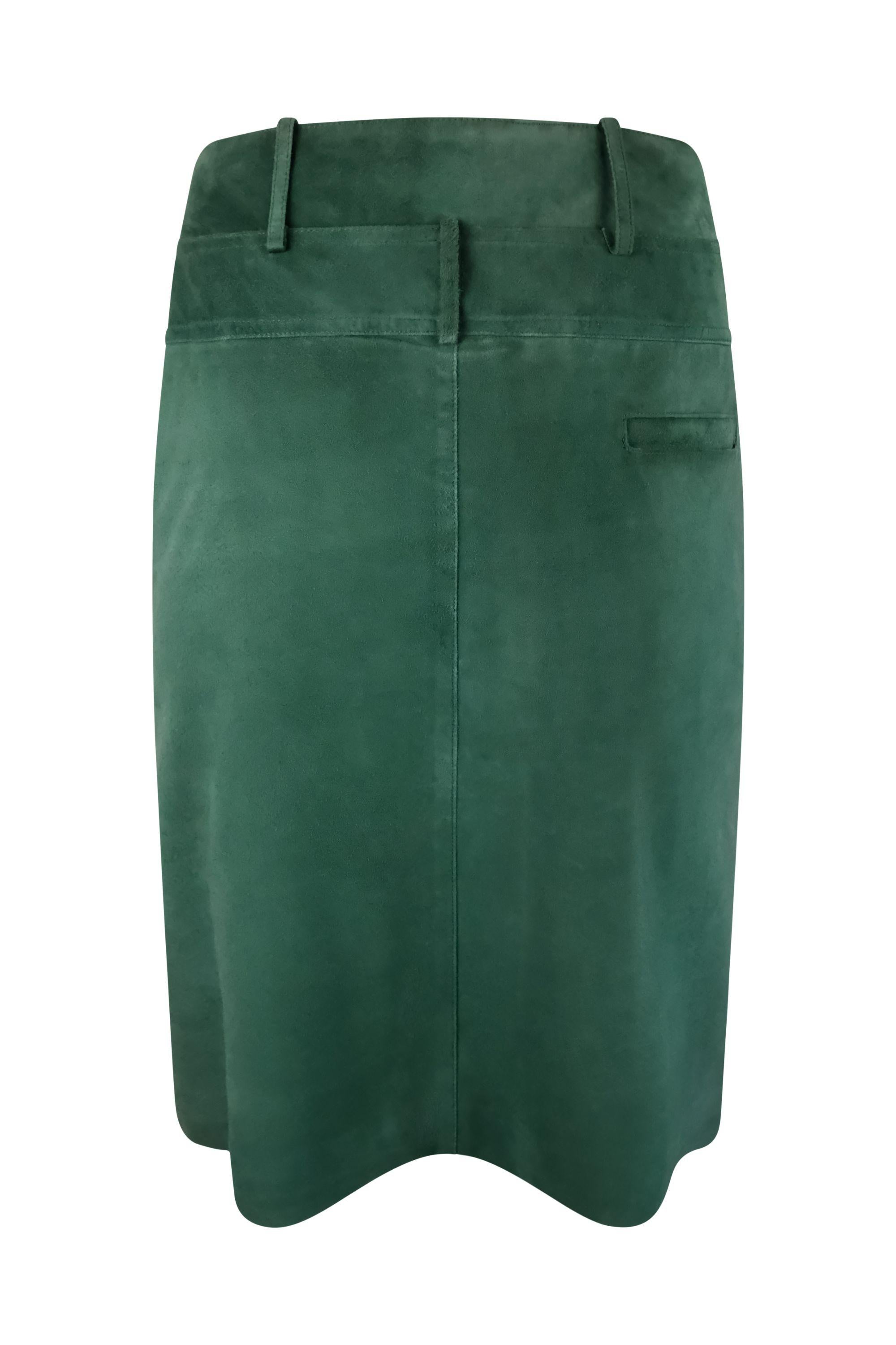 This Fendi suede pencil skirt features a rich forest green hue, a unique and distinctive double waist feature with alternating belt loops, sleek paneling for a structured fit, and a concealed closure. 

Condition details: In good, gently used