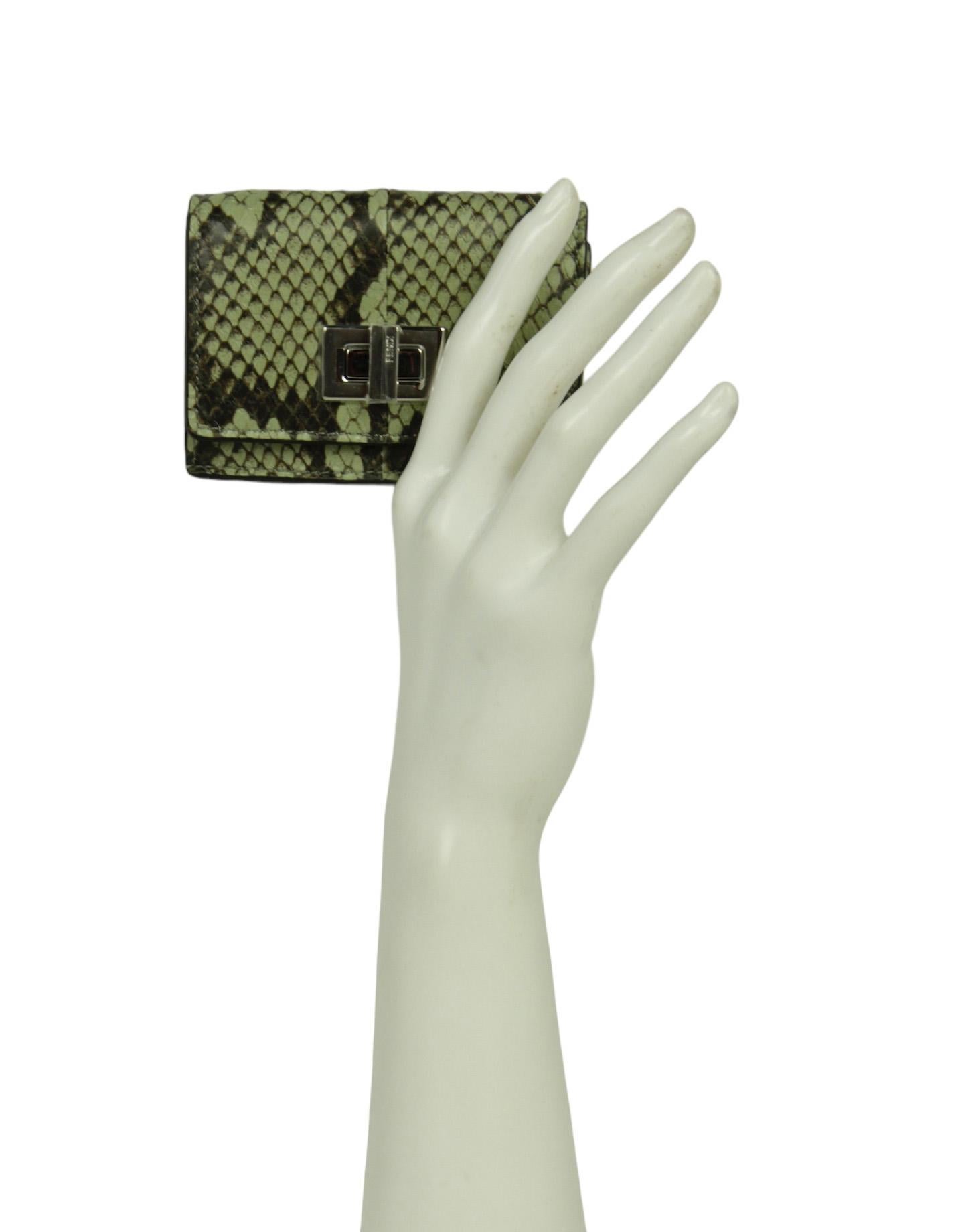 Fendi Green Tea Elaphe Vitello Grace Python Micro Trifold Wallet 

Made In: Italy
Color: Green tea, brown
Hardware: Silvertone
Materials: Elaphe python
Lining: Smooth leather
Closure/Opening: Twistlock
Exterior Pockets: Coin compartment
Interior