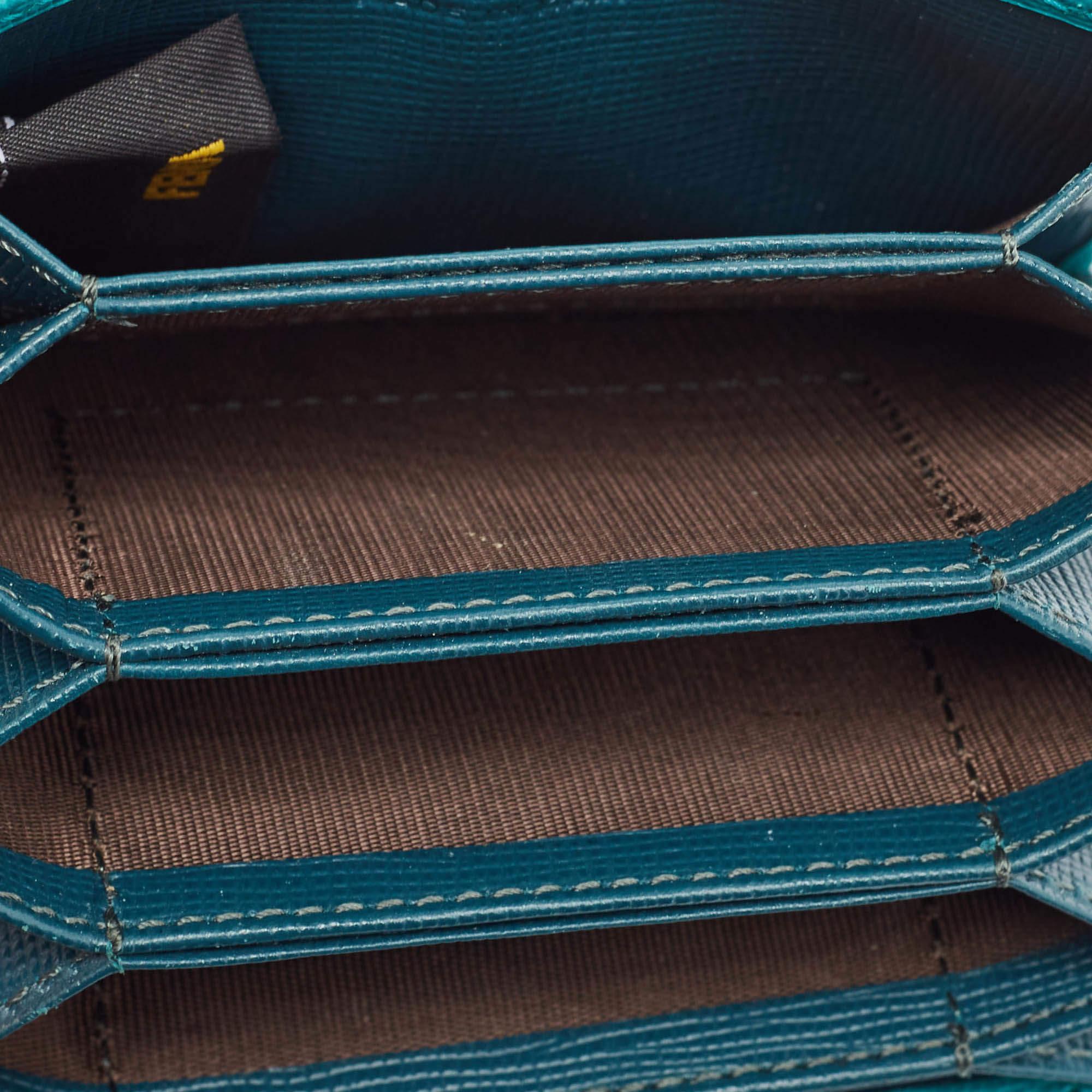 The Fendi green/teal card holder combines elegance and functionality in a sleek design. Crafted from leather it has a luxe look and multiple slots for your everyday cards.