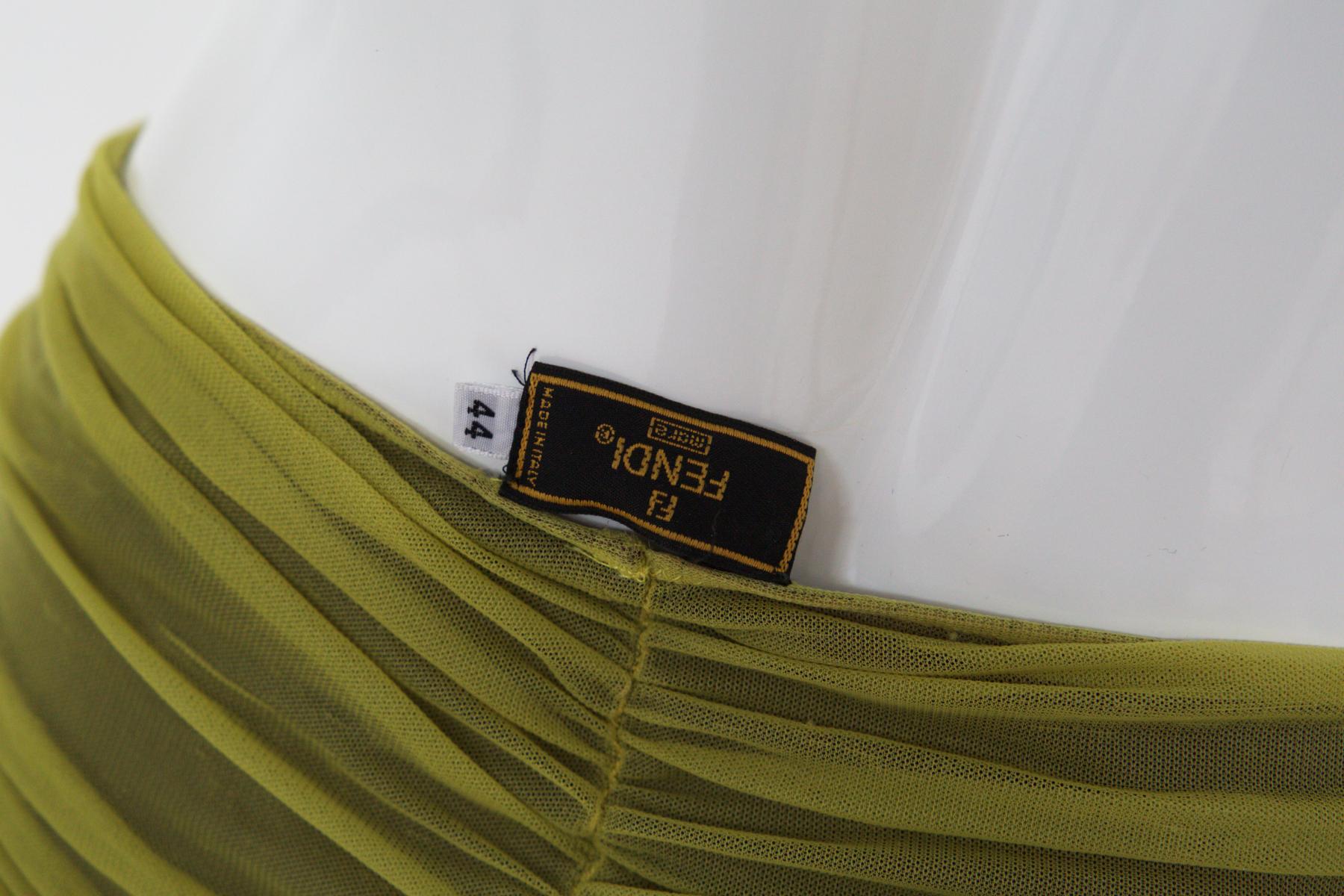 Eccentric green fabric swimwear by Fendi, made in Italy, 1990s. ORIGINAL LABEL.
The swimwear is a trikini. It consists of a bra with two straps with a slight squeeze in the middle of the bust, so as to create a pushup effect. The straps are very