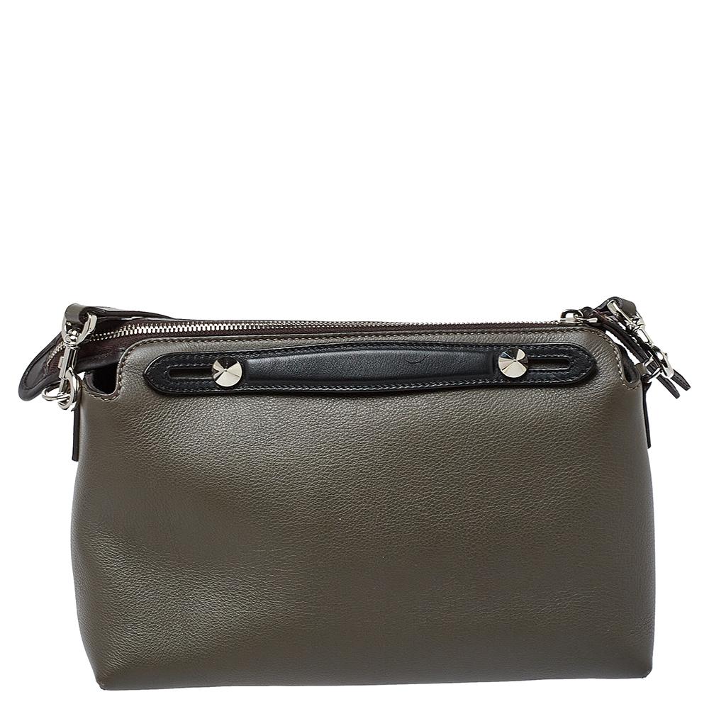 This By The Way bag from Fendi is made from leather. Complemented by silver-tone hardware, it has strap handles and a long shoulder strap for crossbody wear. Its main compartment has room for the essentials and is secured by a zip. It is complete