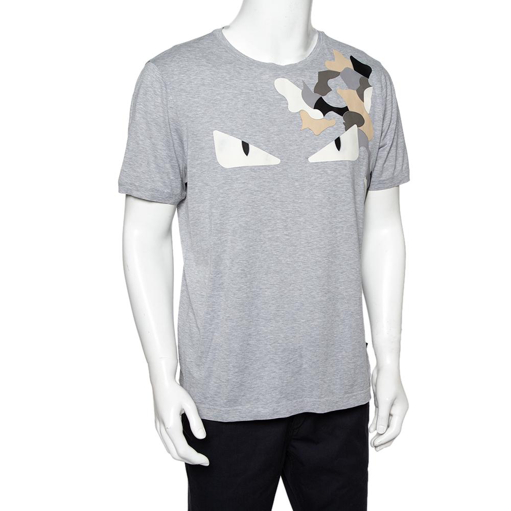 You're sure to love owning this exclusive T-shirt from Fendi. Made from cotton, the grey T-shirt features short sleeves, a crew neckline, and Monster Eyes detailing in leather on the front. Add to your casual style game with this comfortable and