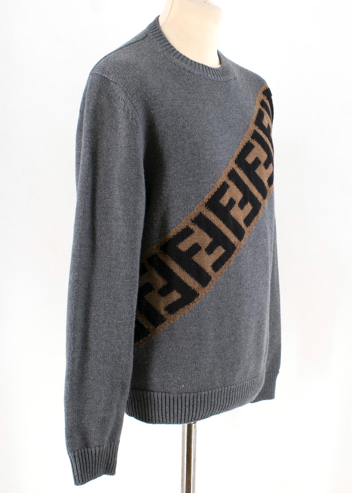 Fendi Grey FF Logo Knit Sweater

- Grey, knit jumper
- Brown and black FF motif logo print
- Long sleeved
- Ribbed hem, cuffs and collar
- Decorative black button detail at hem

Please note, these items are pre-owned and may show some signs of
