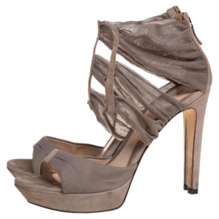 Fendi’s sandals are crafted with the utmost skills and attention to detail. They are made of lace and suede into an open-toe silhouette and feature straps on the uppers. Elevated on 12 cm heels, these sandals exude charm with every step you take.