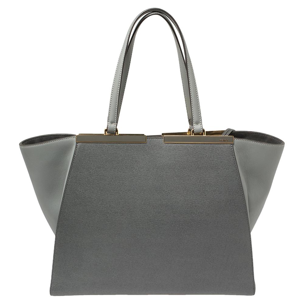 Fendi's 3Jours tote is one of the most iconic designs from the label, and it still continues to receive the love of women around the world. Crafted from grey leather, the bag features double handles. It is also equipped with an Alcantara interior