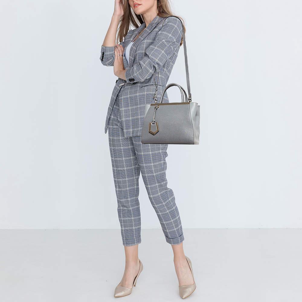 This alluring tote bag for women has been designed to assist you on any day. Convenient to carry and fashionably designed the tote is cut with skill and sewn into a great shape. It is well equipped to be a reliable accessory.