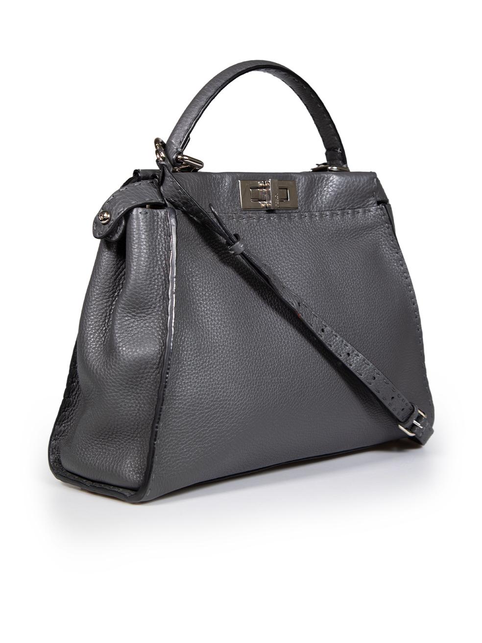 CONDITION is Very good. Minimal wear to bag is evident. Minimal wear to internal plaque with scratches on this used Fendi designer resale item.
 
 
 
 Details
 
 
 Model: Peekaboo
 
 Grey
 
 Leather
 
 Medium top handle bag
 
 Silver tone hardware
