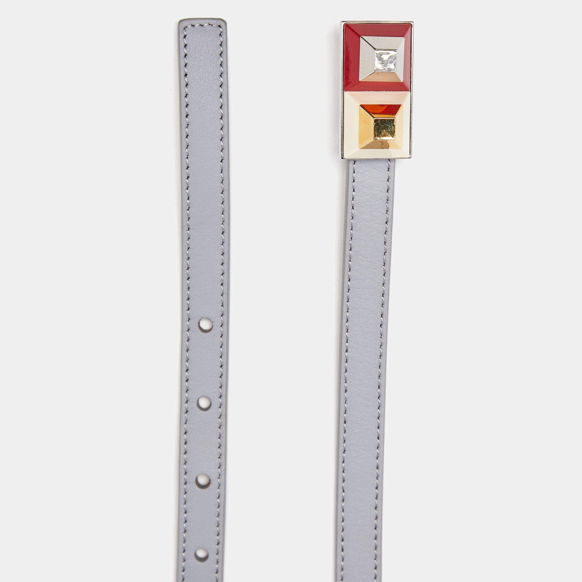 Pull together a multitude of stylish looks with Fendi's grey-colored leather belt. It features a polished gold-tone & silver-tone metal accents. Grab it now!

Includes: Branded Dustabag

