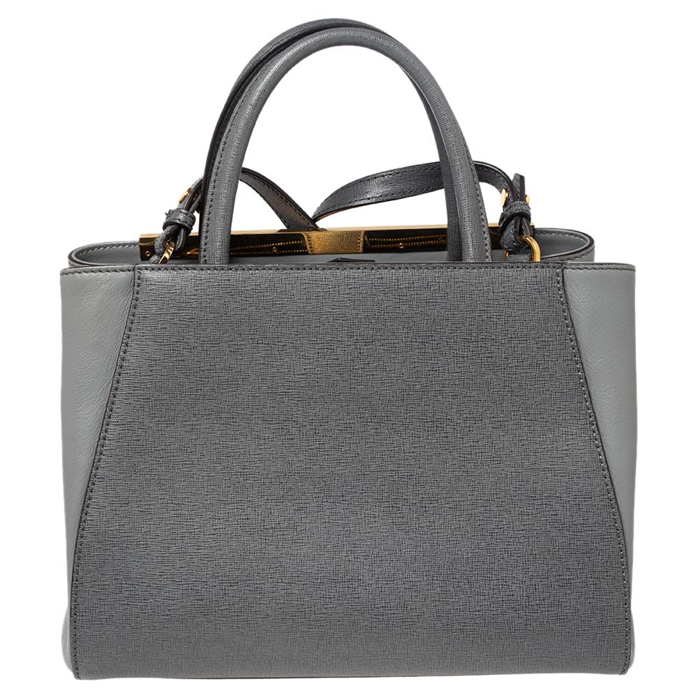 Fendi's 2Jours tote is one of the most iconic designs from the label and it still continues to receive the love of women around the world. Crafted from grey leather, the bag features double rolled handles and a shoulder strap. It is equipped with a