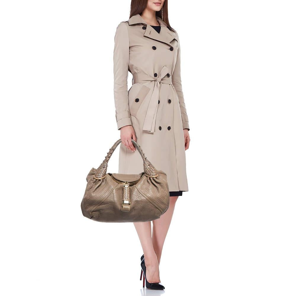 Stylish handbags never fail to make a fashionable impression. Make this designer hobo yours by pairing it with your sophisticated workwear as well as chic casual looks.