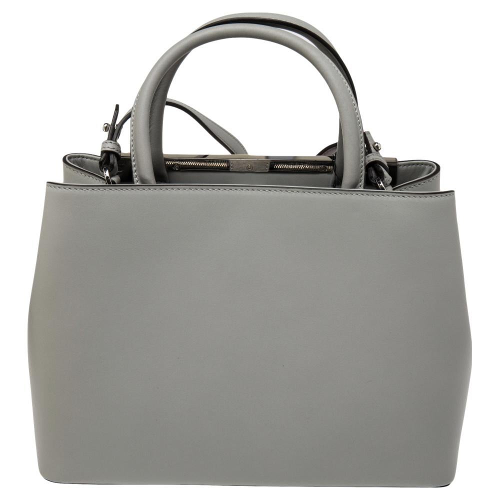 Fendi's 2Jours tote is one of the most iconic designs from the label and it still continues to receive the love of women around the world. Crafted from grey leather, the bag features double-rolled handles. It is also equipped with a leather and