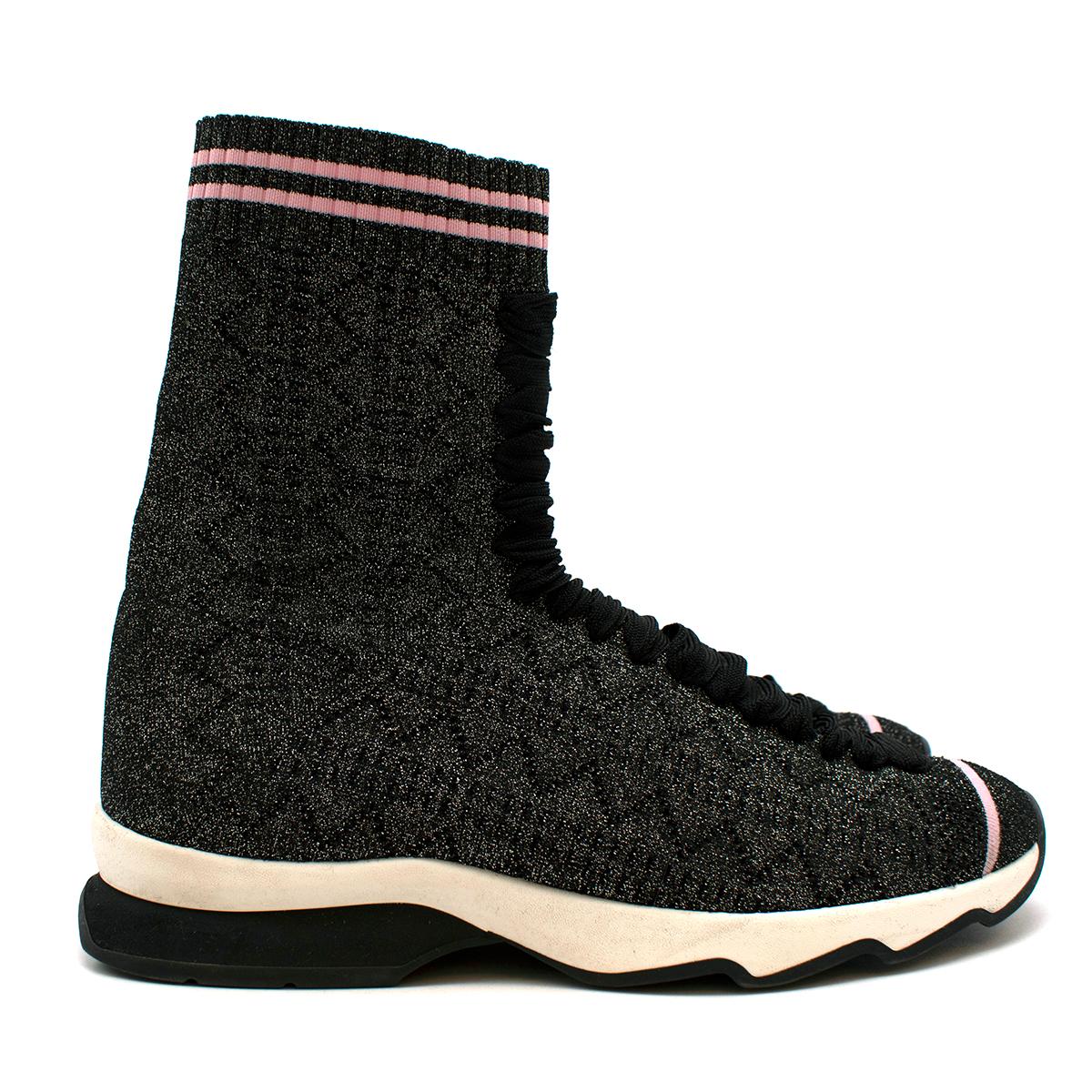 Fendi Grey Lurex Sock Trainers 

The high-top knit sneakers come with a lace-up detailing and a tonal pattern knit throughout. The metallic black iteration comes with pink detailing, contrasting against the glittery material.

Materials:
knit and