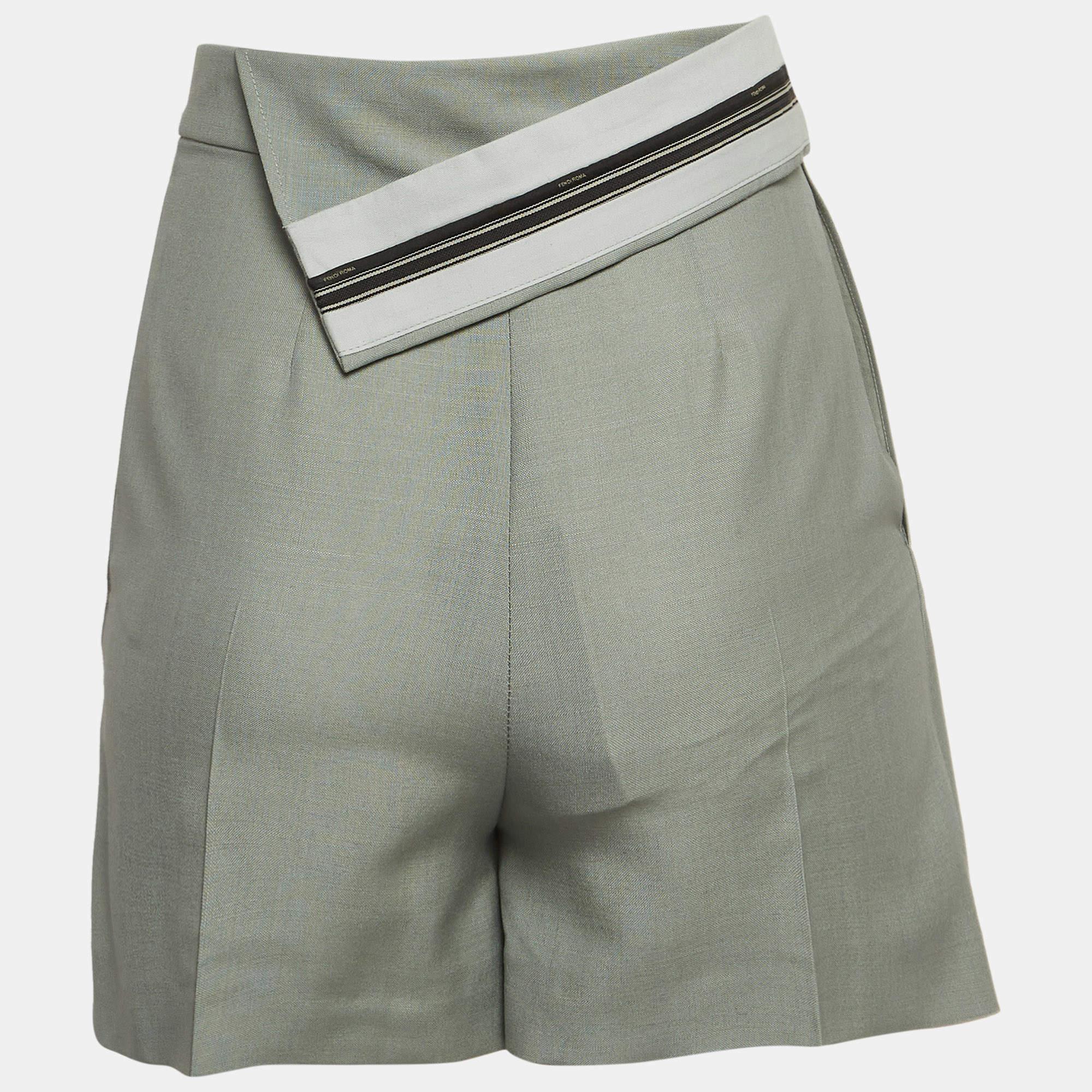 Crafted from luxurious grey mohair blend, these Fendi shorts exude modern charm with their asymmetric layered design. Soft yet structured, they offer comfort and style in equal measure. Perfect for adding a touch of contemporary flair to any