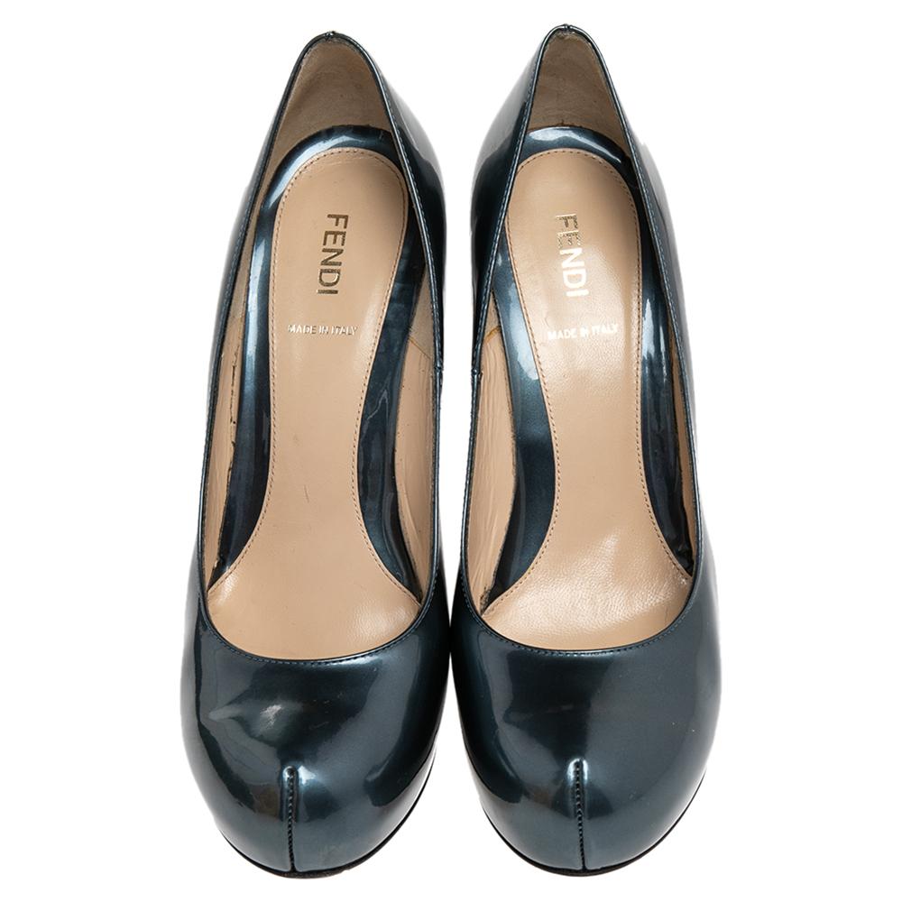 Crafted in Italy and made from patent leather, they feature sophisticated 12.5 cm heels covered with the signature Zucca print for a signature finish. These pumps feature peep toes, platforms, and the insoles are leather-lined for comfort.

