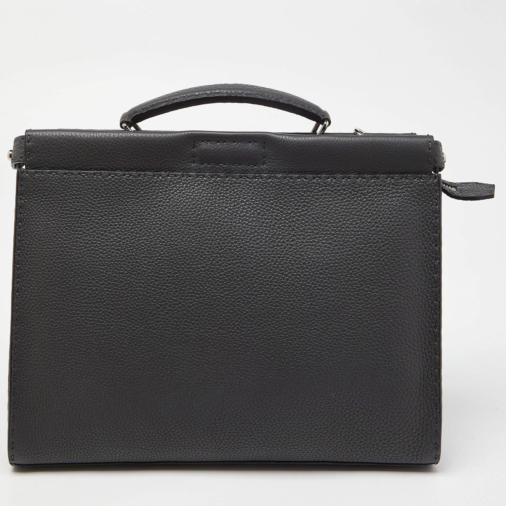 The Peekaboo ISeeU briefcase by Fendi is an ultra-functional choice to carry your essentials! Crafted using leather, the briefcase is perfect for frequent use. It includes a top handle, a shoulder strap, and a spacious interior.

Includes: Original