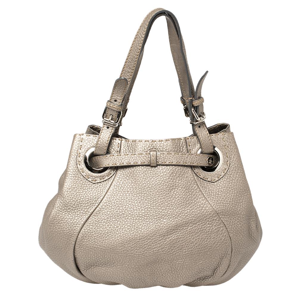 A stylish and durable shoulder bag, this Fendi design will come in handy on all days. Crafted using leather, it has a belt detail around the top, two buckled handles, canvas-lined interior, and silver-tone hardware.

Includes: Original Dustbag
