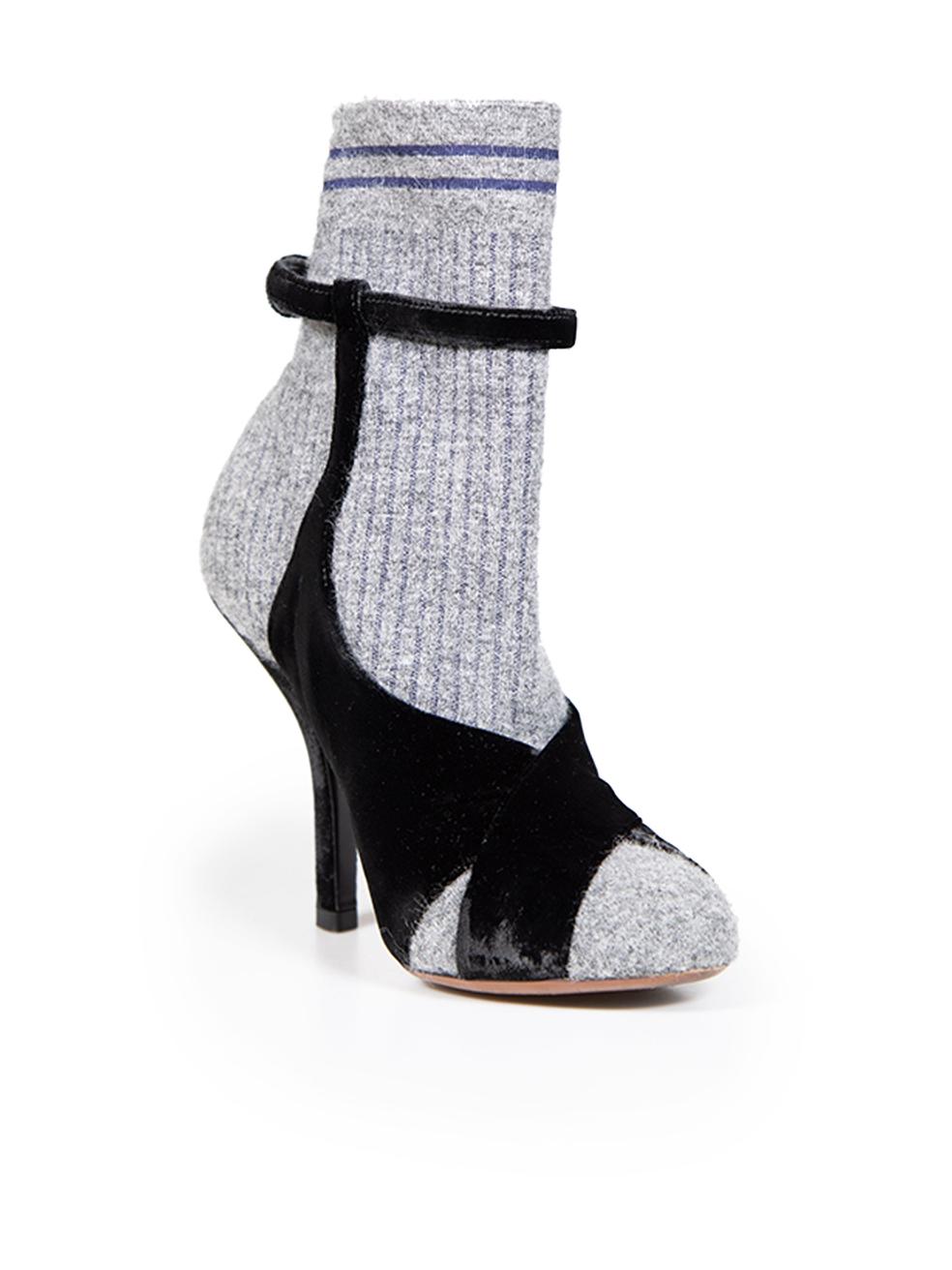 CONDITION is Very good. Minimal wear to boot is evident. Minimal wear to velvet on the left side of the right shoe on this used Fendi designer resale item. Comes with original dust bags and box.
 
 
 
 Details
 
 
 Grey with black accents
 
 Cloth