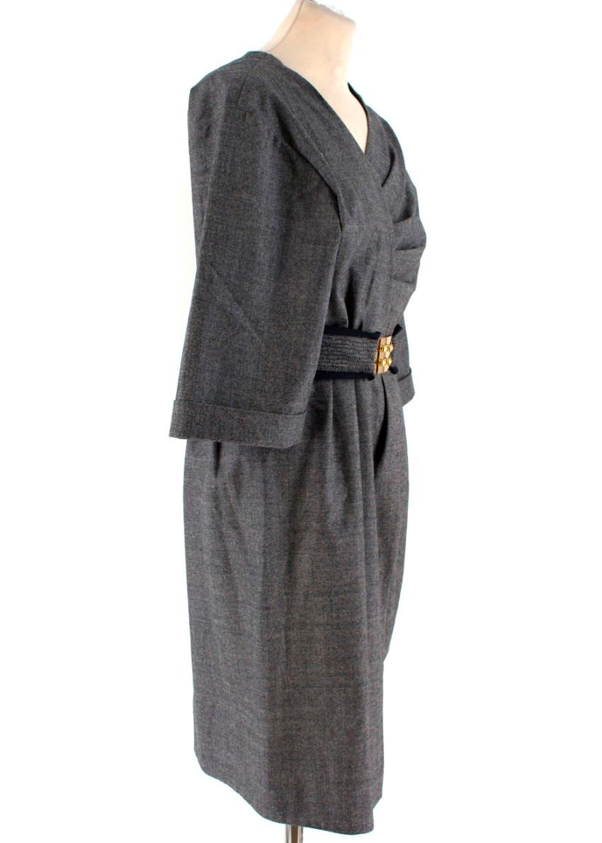 Fendi Grey Wool Pleated Dress

-Grey wool dress with asymmetric pleating
-Belt with gold toned hardware
-3/4 length oversized sleeves
-Front slit
-Pleated skirt
-Concealed side zip closure

Please note, these items are pre-owned and may show signs