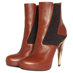 Fendi, hidden platform boots in cognac leather