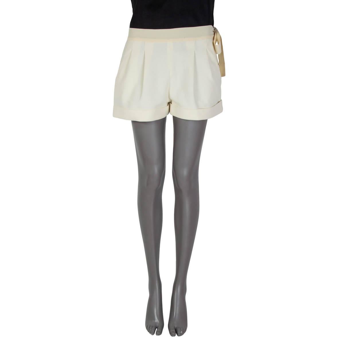 100% authentic  Fendi pleated rib shorts in off-white cotton (97%) and lycra (3%). Embellished with an off-white waist band. Opens with four metallic buttons on the side. Unlined. Have been worn and are in excellent condition.

Measurements
Tag