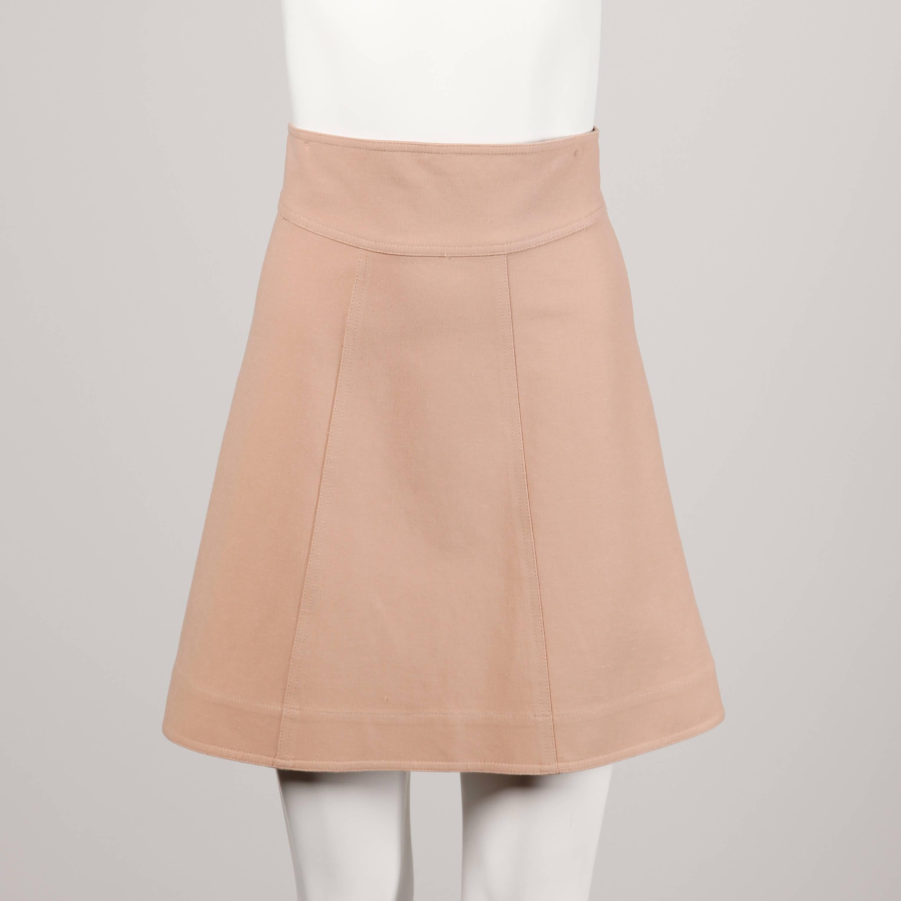 Stunning blush pink avant garde jacket and skirt ensemble by Fendi. Unique 3/4 length sleeves and double breasted buttons on the jacket. A-line cut on the skirt. Wear together or as separates!

Details: 

Unlined
Skirt: Back Zip and Button/ Jacket: