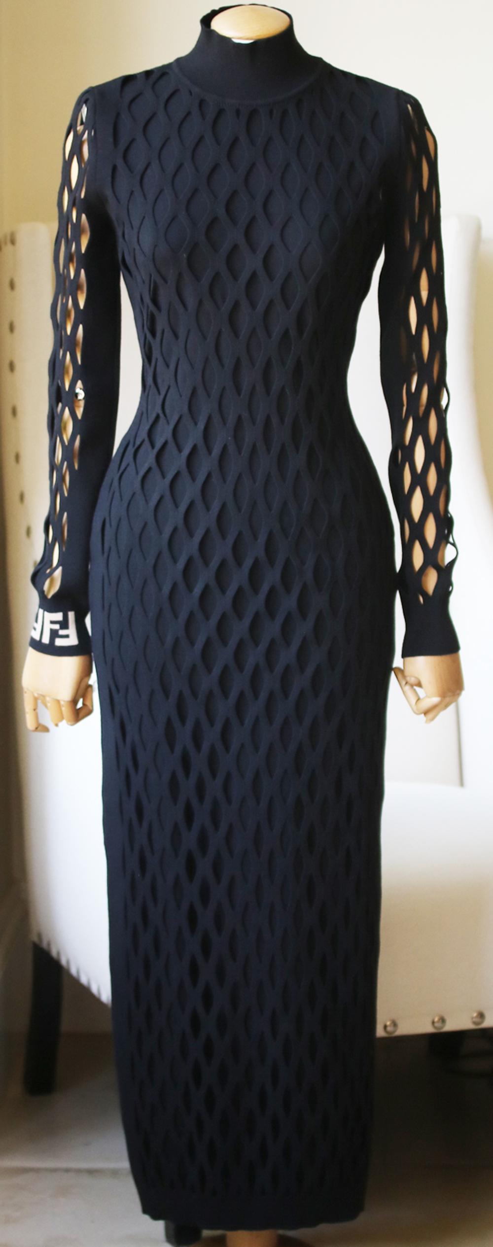 Fendi's jacquard-knit stretch-mesh midi dress features the house's iconic 'FF' monogram in beige on the wrist.
Designed to accentuate your curves, it has a turtleneck and long oversized mesh cutout sleeves.
Black stretch jacquard-knit.
Slips on.
67%