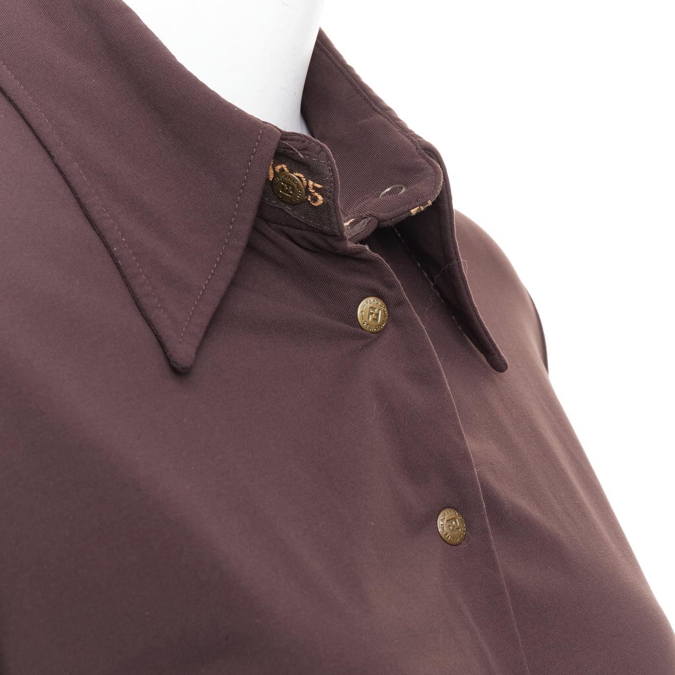 FENDI Jeans Vintage brown FF logo buttons fitted long sleeves shirt
Reference: CNPG/A00110
Brand: Fendi
Collection: Jeans
Material: Jersey
Color: Brown
Pattern: Solid
Closure: Snap Buttons
Extra Details: FF logo buttons.
Made in: