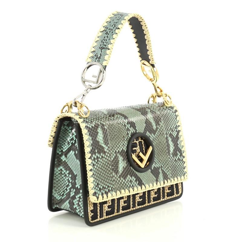 This Fendi Kan I F Shoulder Bag Python with Zucca Raffia Medium, crafted from genuine green python with neutral zucca raffia, features a flat top handle, Fendi logo, and gold-tone hardware. Its magnetic snap closure opens to a gray microfiber