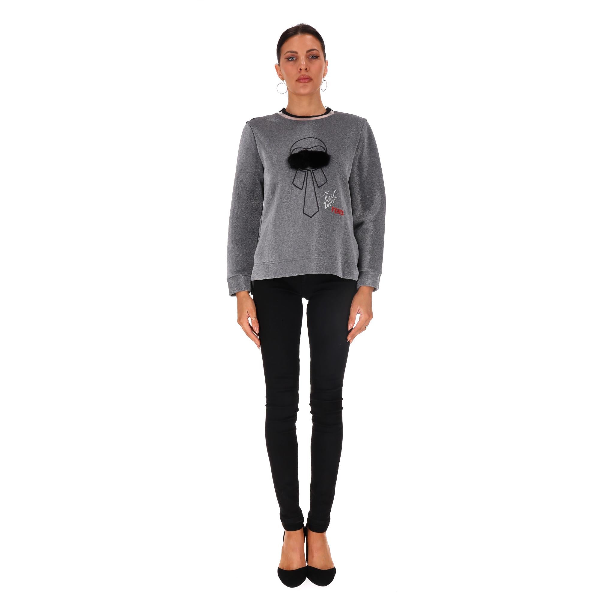 Fendi Karl Lagerfeld Embroidered Laminated Sweatshirt

Grey 'Karlito' top with Karlito embroidery at the front, black faux-fur appliqués and 'Karl Lagerfeld' signature.

Featuring metallic sheen design, ribbed crew neckline with zipped shoulders and