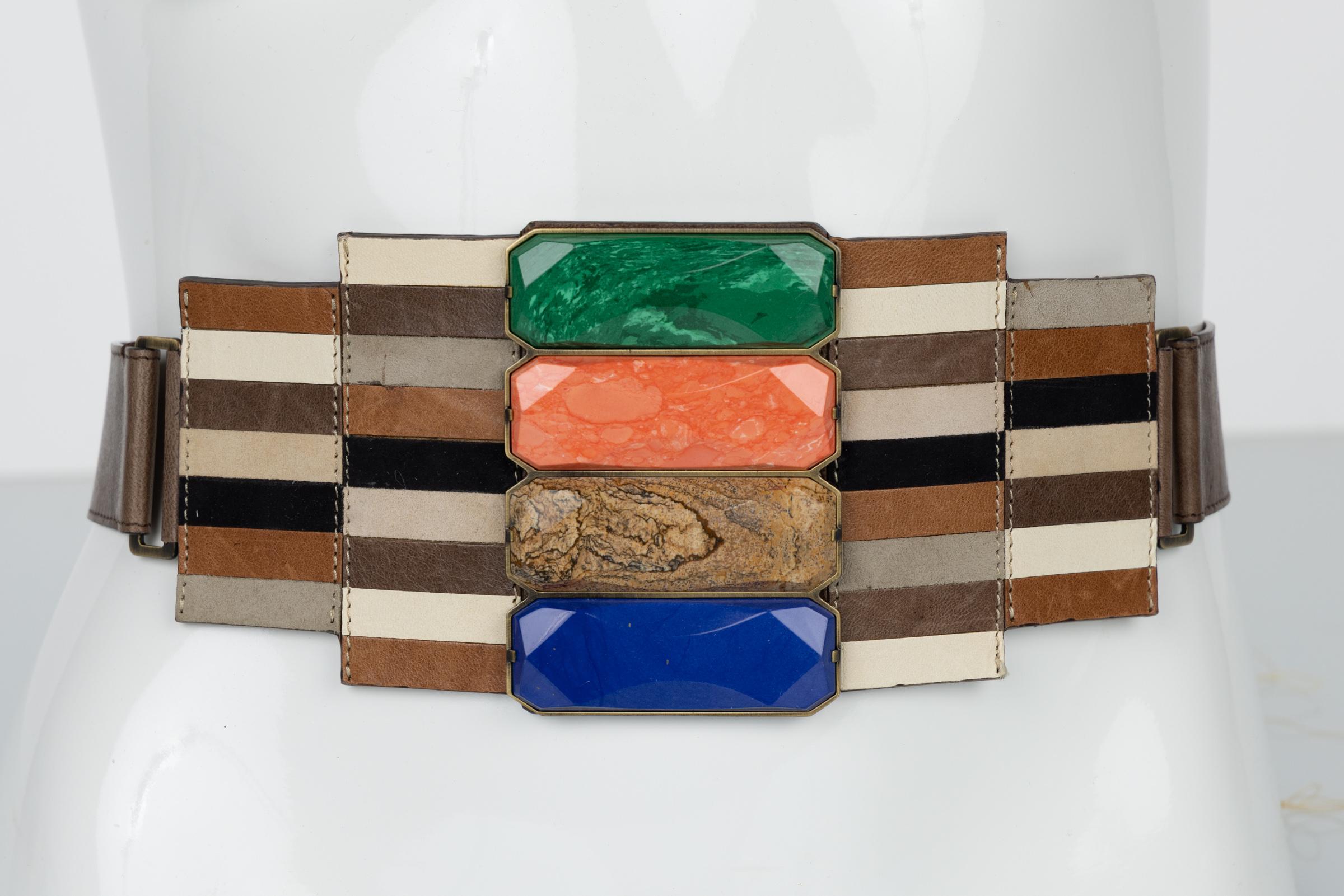 Fendi spring 2008 Memphis style belt. Done in mosaic pieced leather with four large faceted cabochons in lapis, jasper, coral, and malachite.
This belt is from look #16 on the runway.
Closes at the back with a brass plaque hook.
New with tags