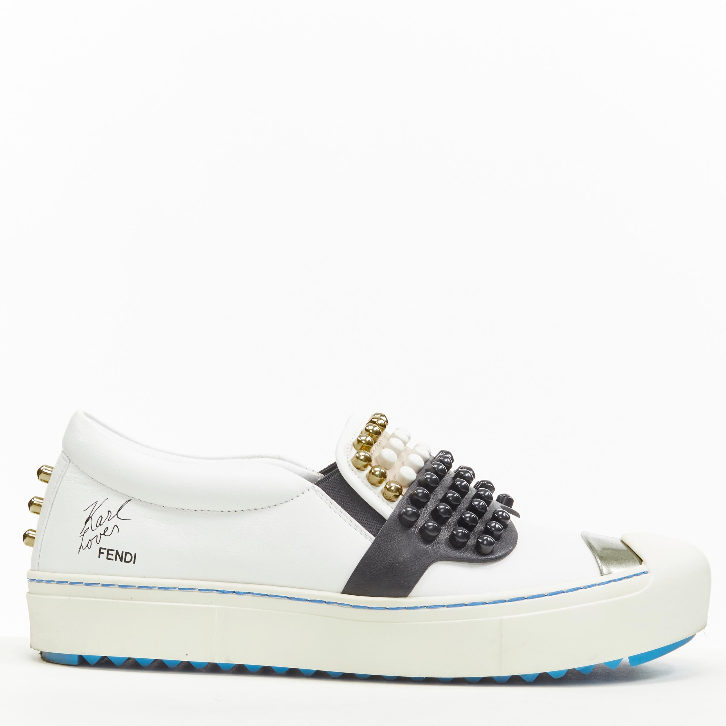 FENDI Karl Loves studded Karlito white leather skate sneakers EU36.5 
Reference: ANWU/A00362 
Brand: Fendi 
Collection: Karl Loves 
Material: Leather 
Color: White 
Pattern: Solid 
Extra Detail: Abstract Karlito face design in ball studs. Rubber