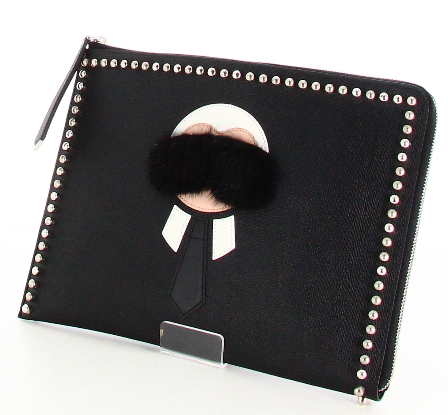 Fendi Karlito Clutch Bag Black Leather 

- Very good condition. Shows no signs of wear over time. 
- Fendi Clutch Bag Black 
- Black leather 
- Karl Lagerfled face in center
- Clasp: silver zipper