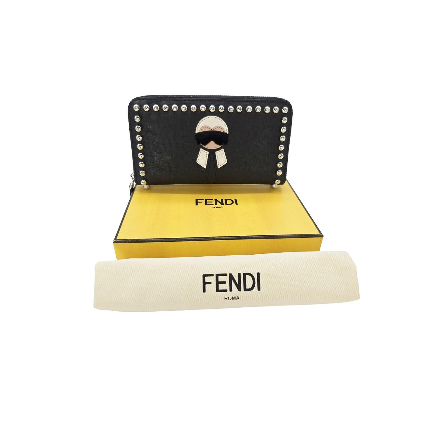 Indulge in luxury with the Fendi Karlito Karl Lagerfeld Leather Studded Wallet. Made of cross-grain leather and bordered with rounded studs, this zip-around wallet features a gusseted interior with ample space for your essentials. The iconic Karlito