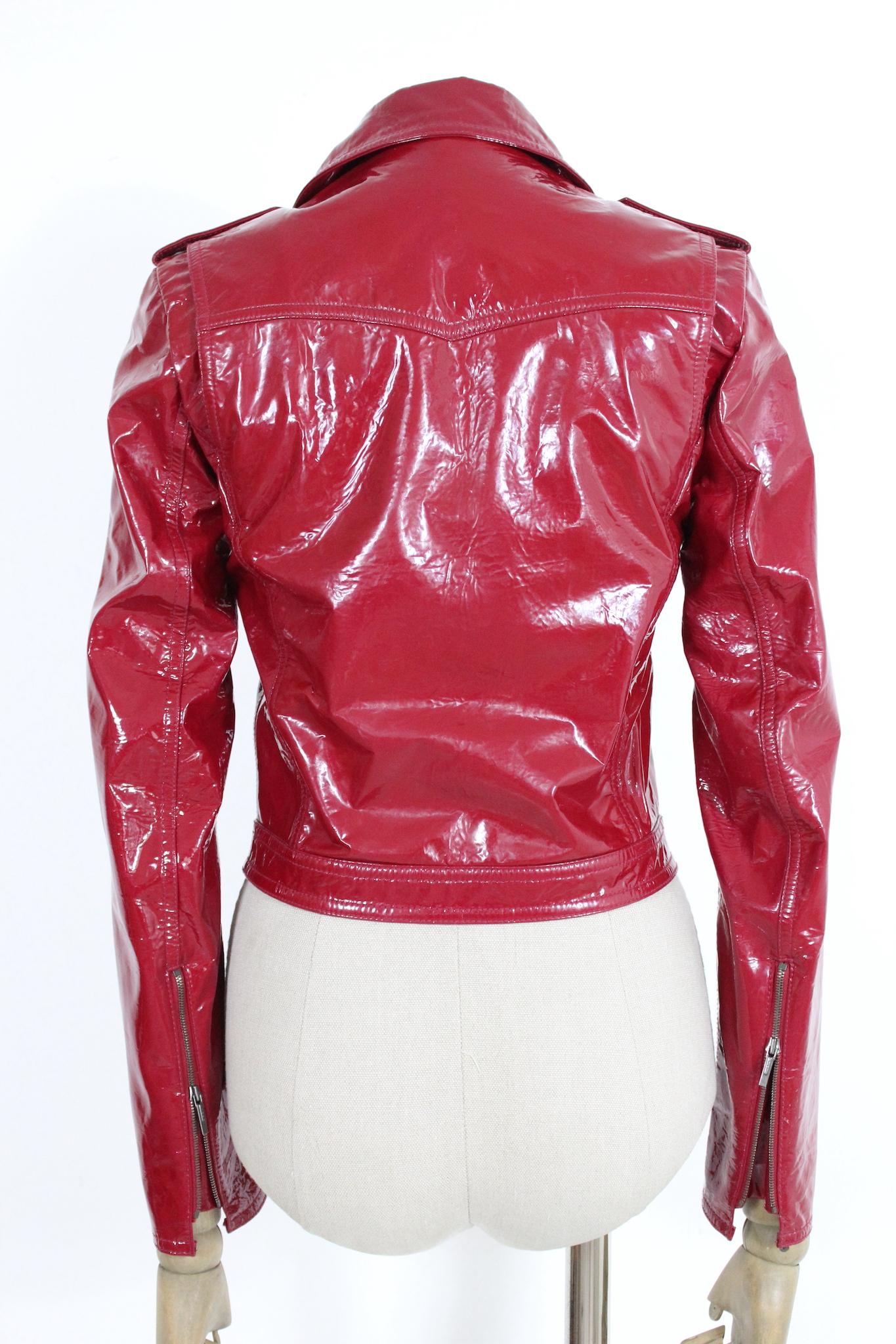 Fendi red patent leather chiodo jacket. Short biker style jacket, ideal for all seasons. Make your style unique and aggressive with this wonderful Fendi leather jacket. Buttons and zip with Fendi logo, the inner lining of the jacket is made of silk