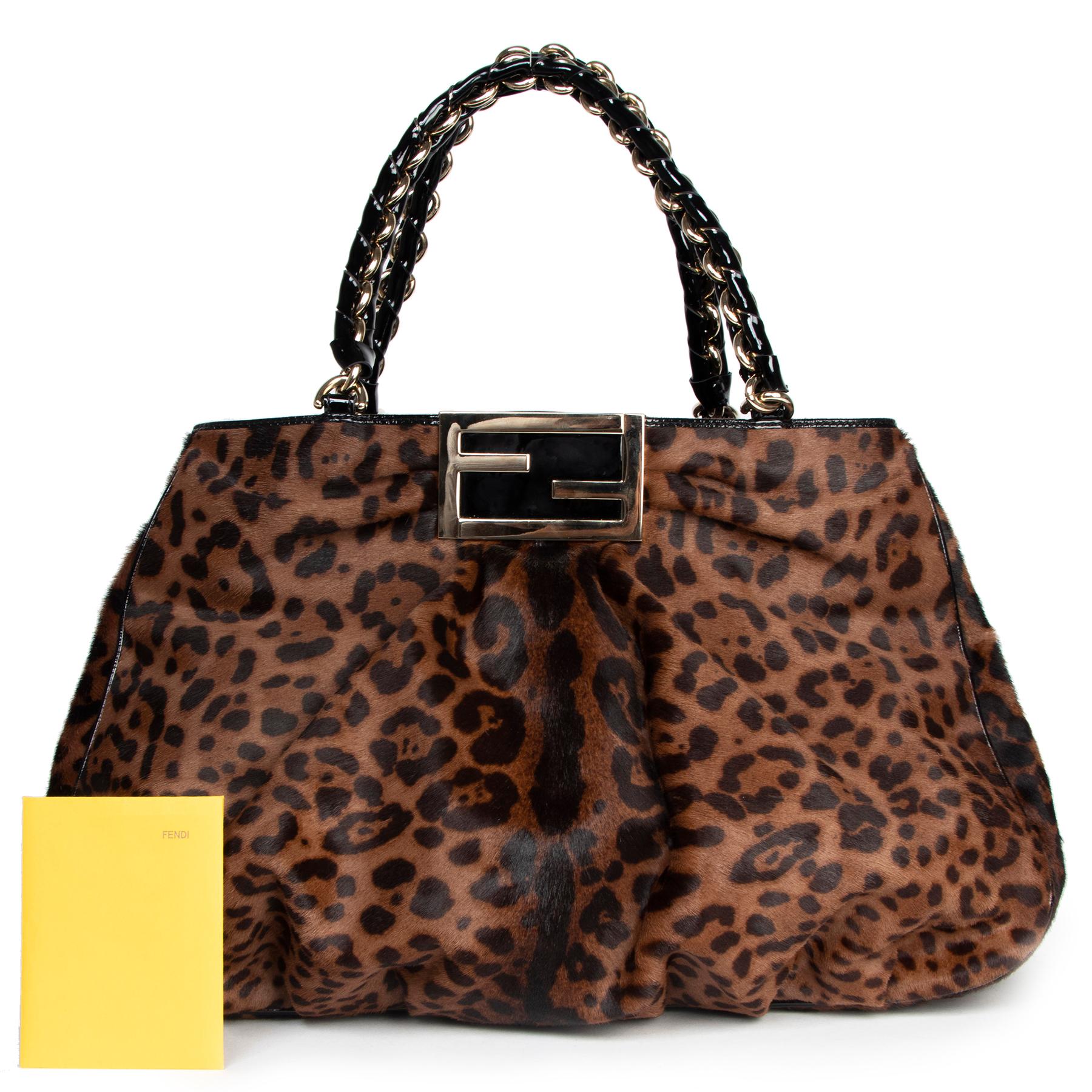 Very good preloved condition

Fendi Leopard Print Ponyhair Patent Leather Tote

This Leopard is ready to roam the streets with you, this beautiful bag in leopard print is crafted in luxurious ponyhair and finished with black dual braided patent
