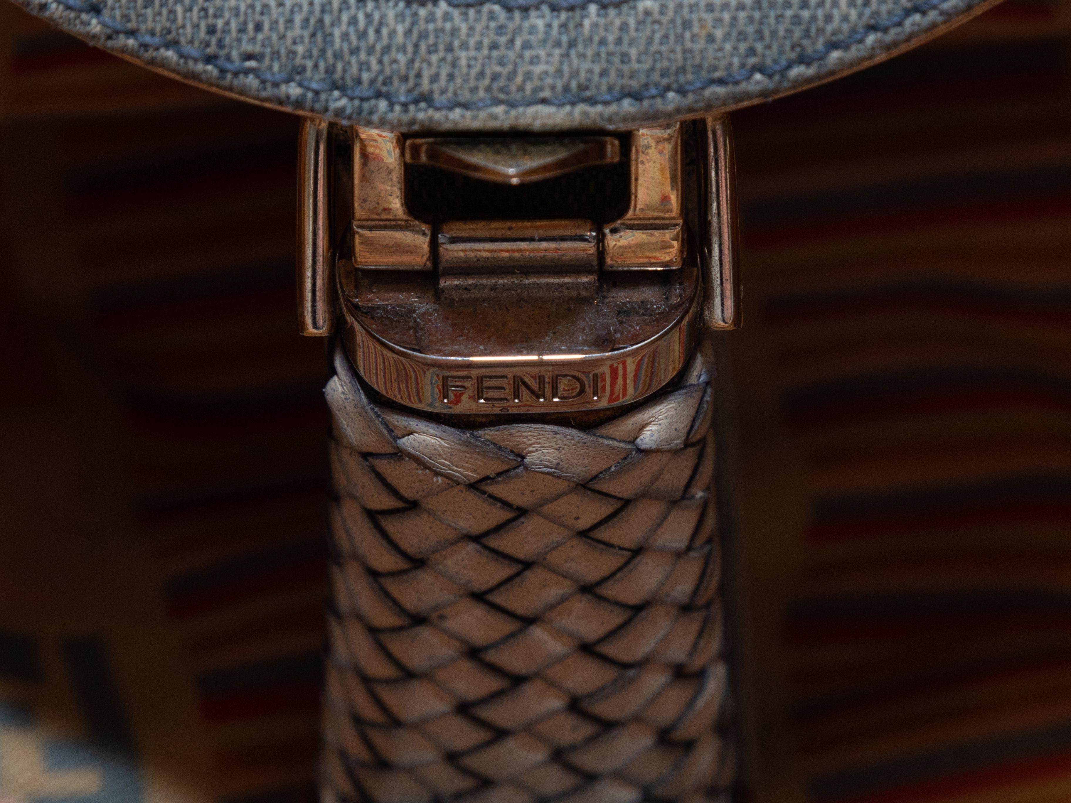 Product Details: Light Blue Fendi Denim Squirrel Embroidered Spy Bag. This bag features a denim body, white woven leather trim, silver-tone hardware, dual top handles, and a front clasp closure. 17