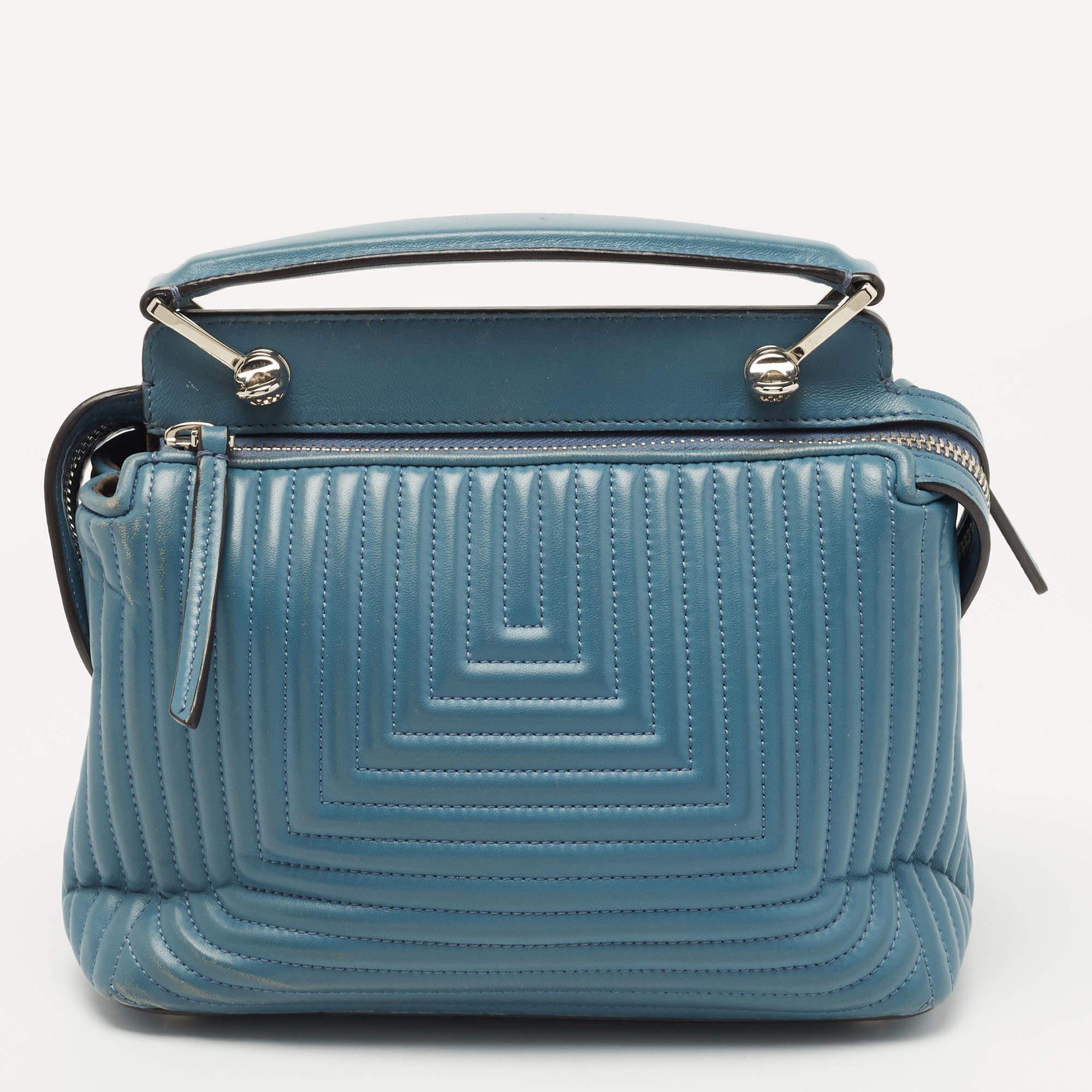 Exuding unparalleled elegance and sophistication, this bag is made from the finest material in a gorgeous hue. While the roomy interior offers ample space, the top handle allows you to carry it with much elegance.

Includes: Detachable Strap,