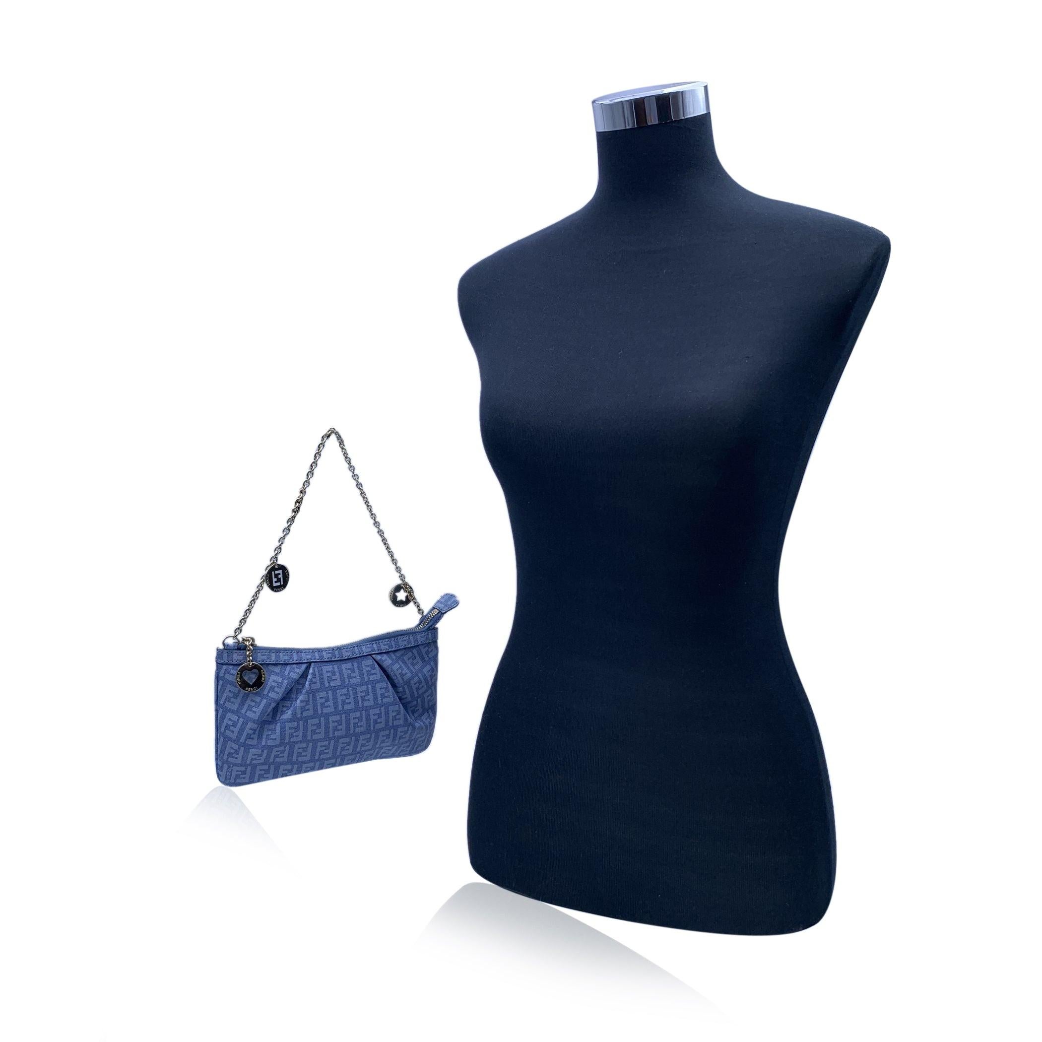 Lovely Fendi small pochette bag in light blue Zucchino monogram canvas. It features a light gold metal chain strap with 2 charms, Upper zipper closure. Beige fabric lining. 'Fendi - Made in Italy' tag inside. Authenticity serial number. FENDI