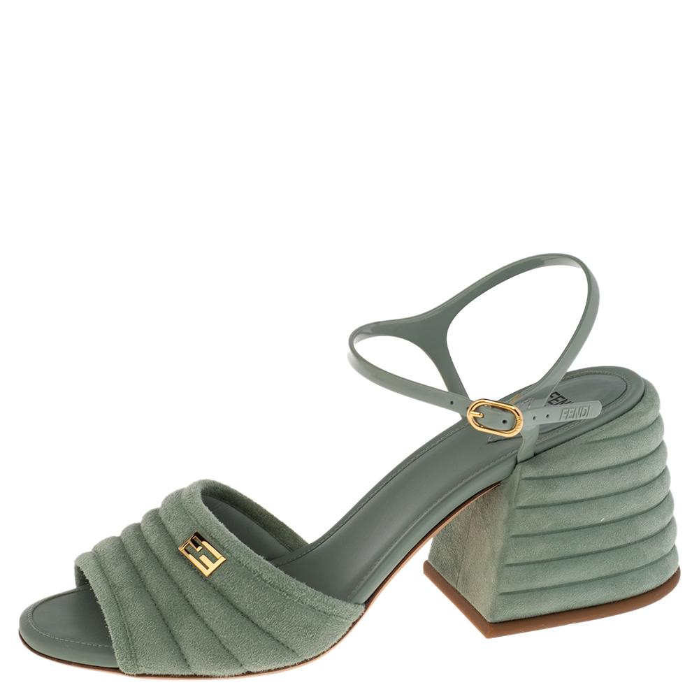 Displaying a simplistic design and sturdy shape, these Promenade sandals from Fendi are long-lasting and unfailingly modern. They are created using light-blue suede and jelly on the upper with a gold-toned FF logo perched on the frontal strap. To
