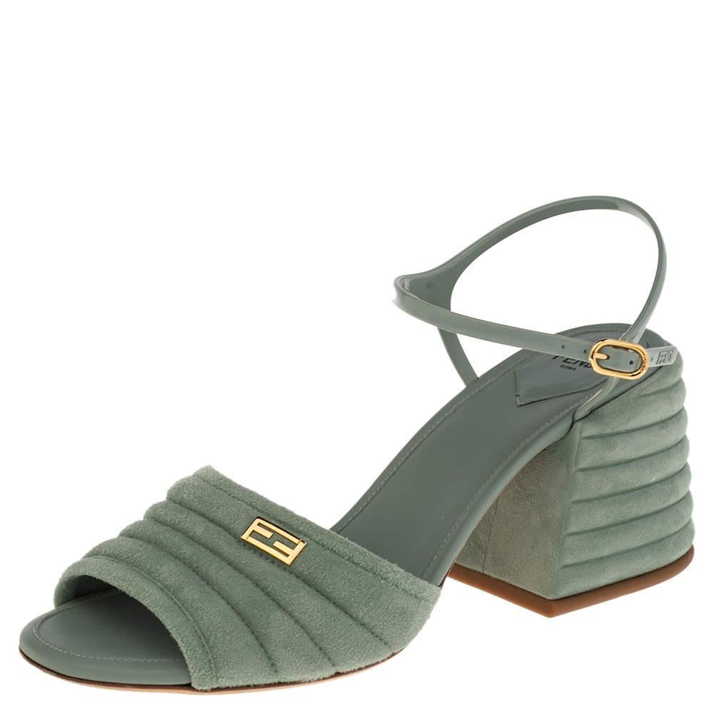 Displaying a simplistic design and sturdy shape, these Promenade sandals from Fendi are long-lasting and unfailingly modern. They are created using light-blue suede and jelly on the upper with a gold-toned FF logo perched on the frontal strap. To