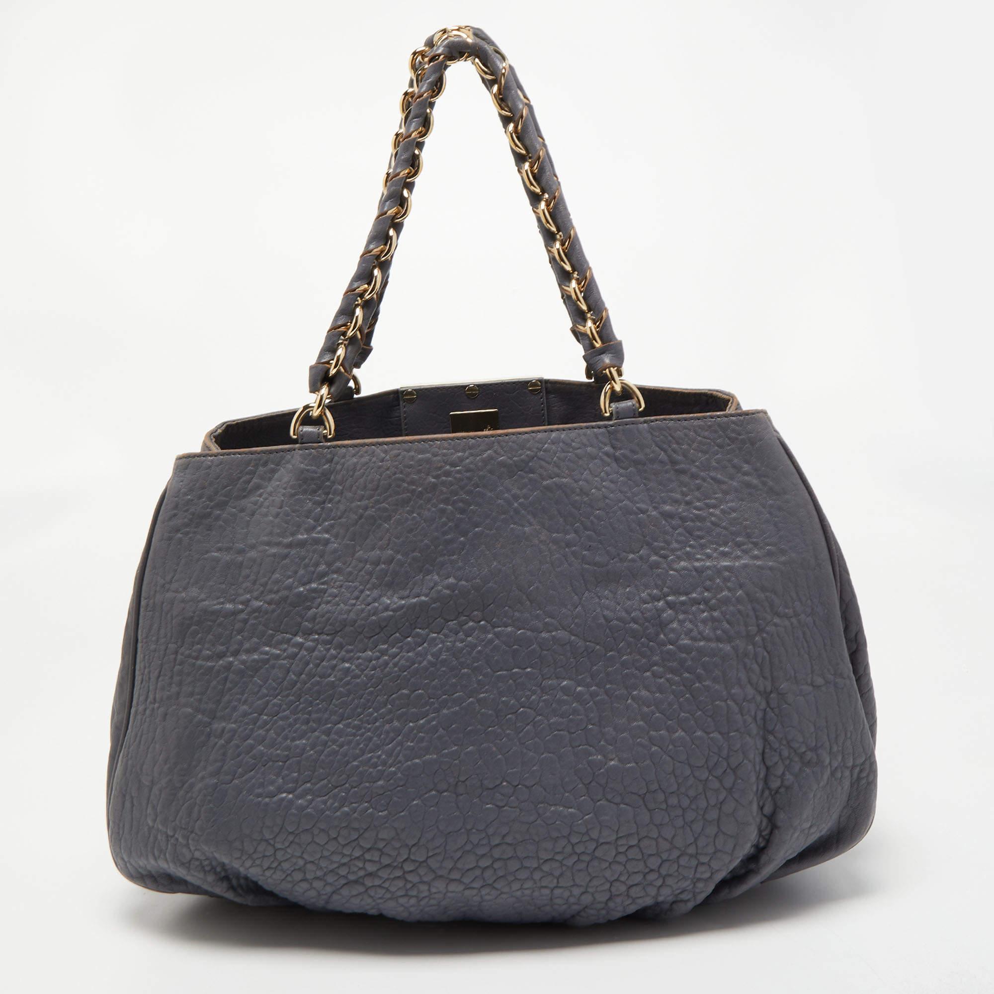 Stylish handbags never fail to make a fashionable impression. Make this designer hobo yours by pairing it with your sophisticated workwear as well as chic casual looks.

Includes: Original Dustbag

