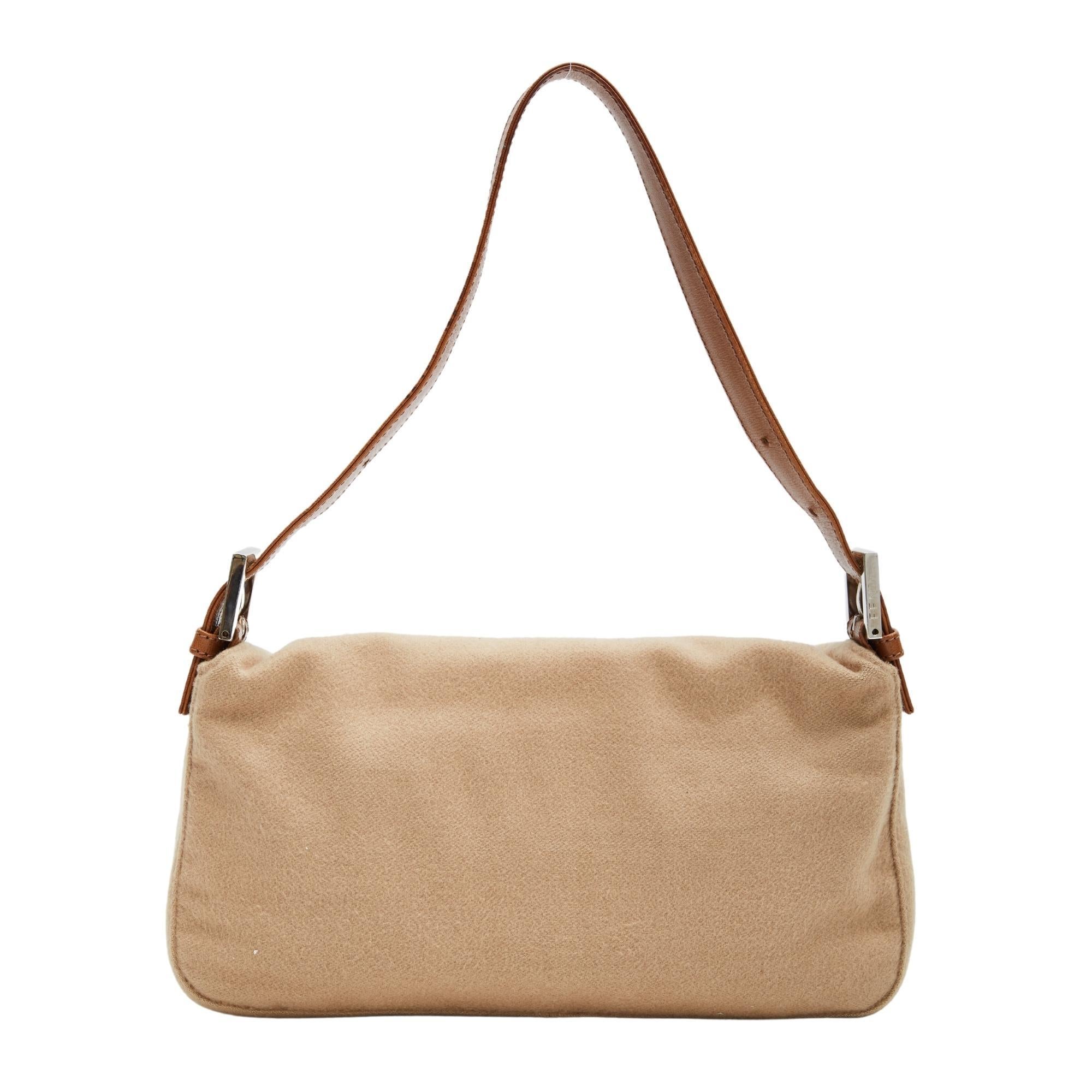 Color:  Light beige/ light brown
Material: Cloth
Item code: 2454/26424/099
Comes with: No brand bust bag
Condition: Good, FF detail on buckle was glued back on. Glue on hardware. Clean bag looks rarely used with minimal signs of use.
Made in
