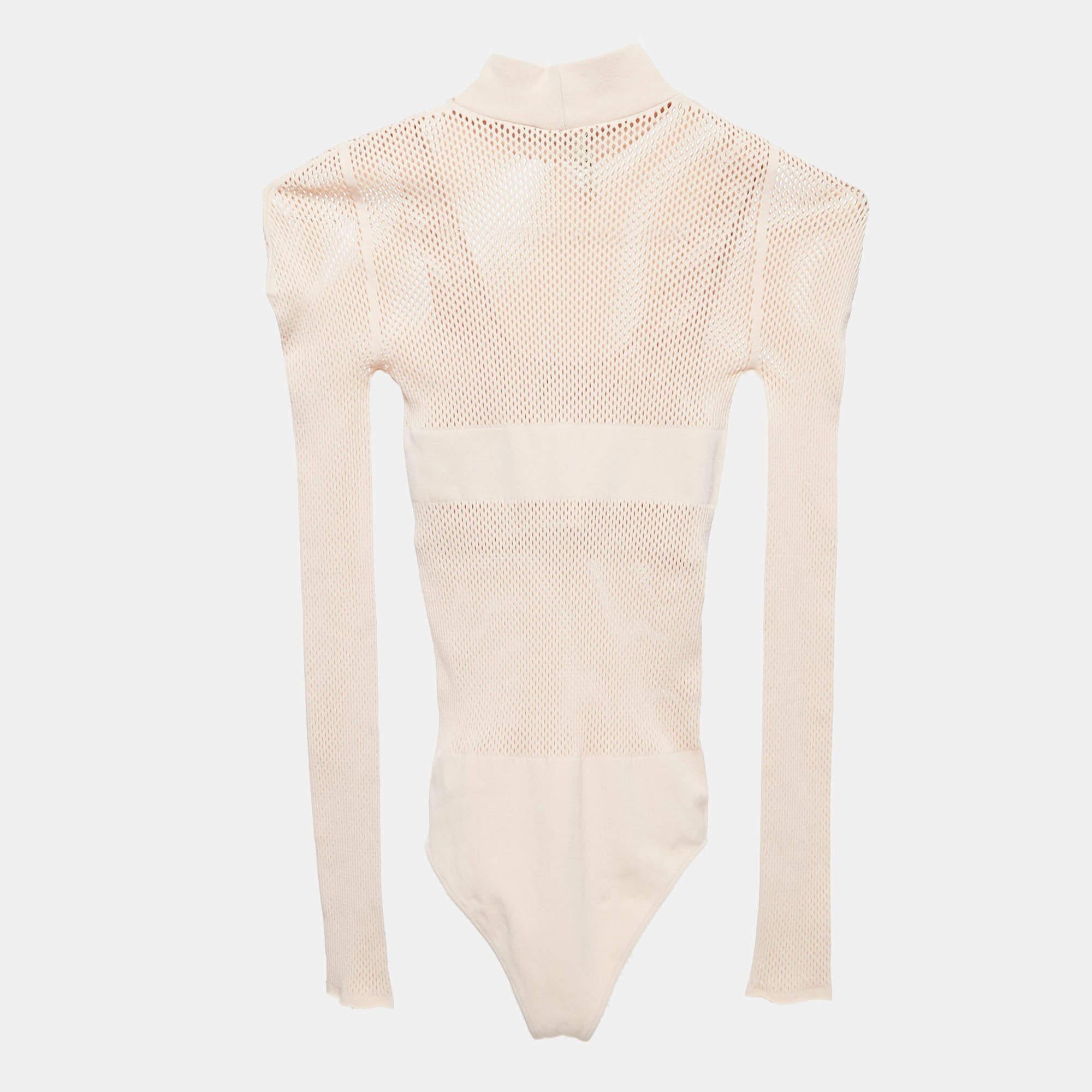The Fendi bodysuit exudes elegance with its soft, finely woven fabric. The form-fitting silhouette seamlessly blends comfort and style, featuring a delicate knit pattern. This versatile piece effortlessly elevates any wardrobe, embodying Fendi's