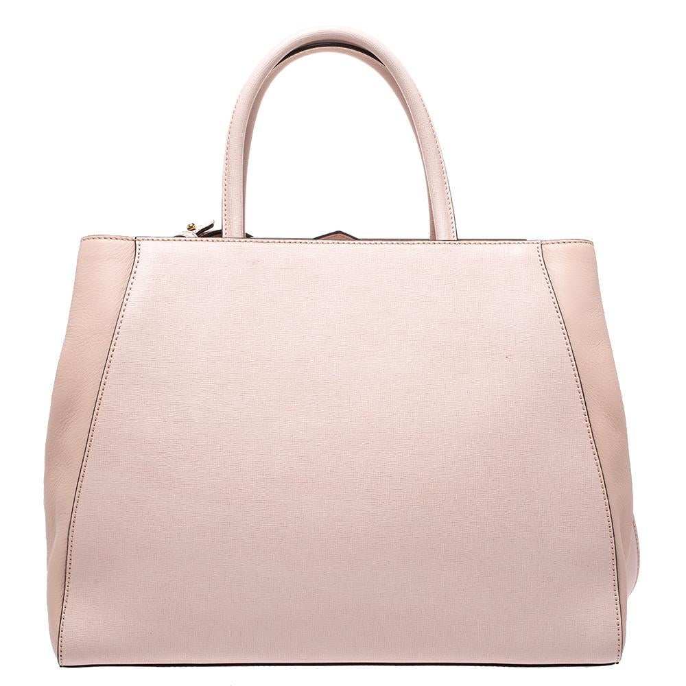 Fendi's 2Jours tote is one of the most iconic designs from the label and it still continues to receive the love of women around the world. Crafted from light pink leather, the bag features double rolled handles. It is also equipped with a fabric