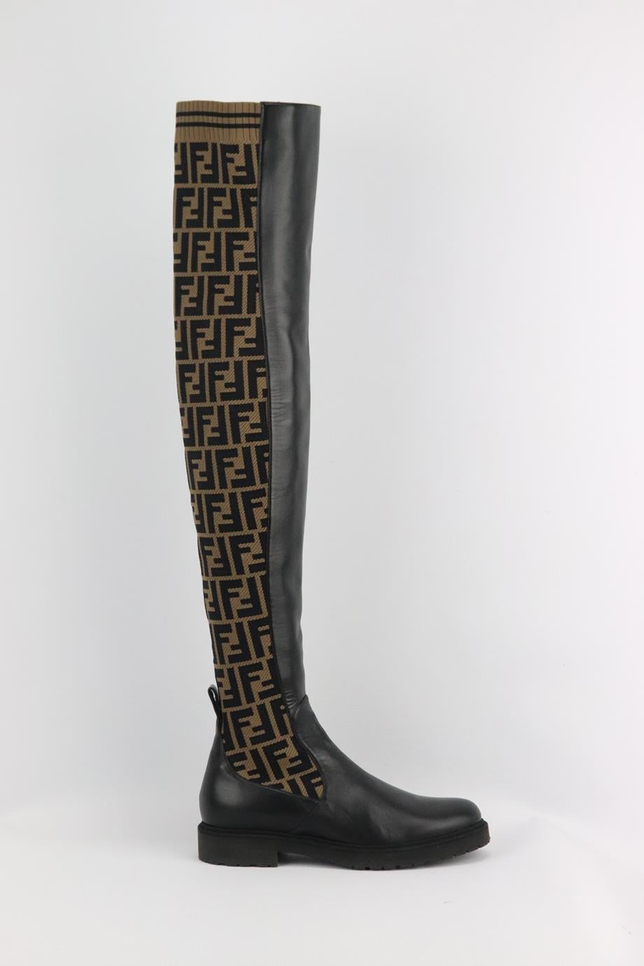 Fendi logo jacquard stretch knit and leather over the knee boots. Black, beige and brown. Pull on. Does not come with box or dustbag.Size: EU 38 (UK 5, US 8). Shaft: 26 in. Outersole: 10.8 in. Heel: 1 in
